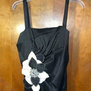 Black cocktail dress with beautiful flower